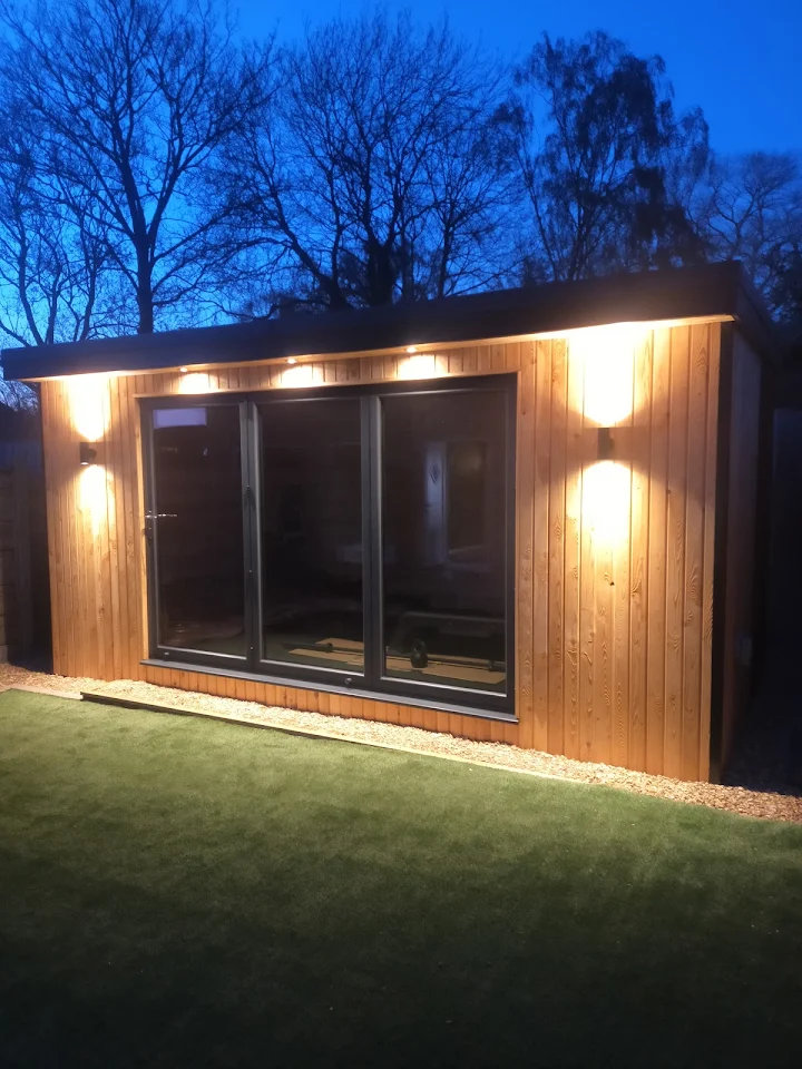 Elite wood-clad private fitness studio with professional lighting and premium equipment - exclusive training environment for Hale Barns WA15 residents